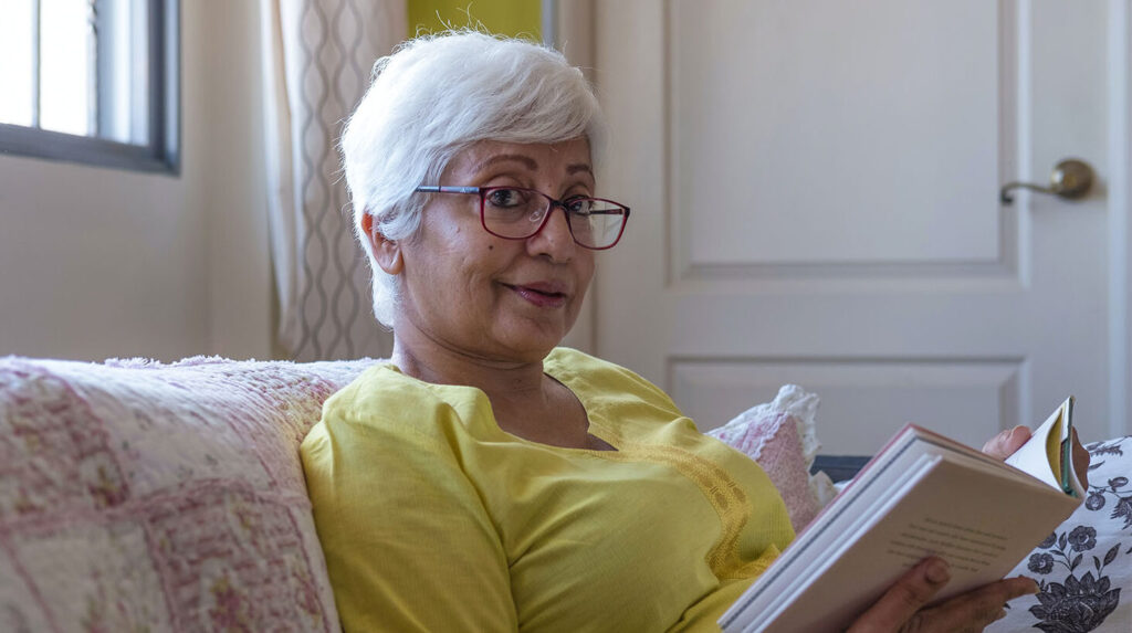 woman reading a book in respite care
