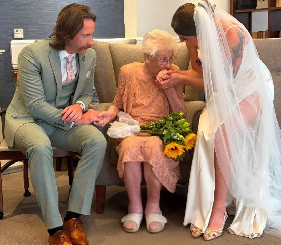 married couple sat with an older lady